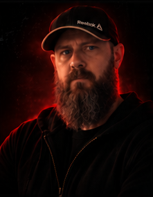 Portrait of Randy Stover in red light.
